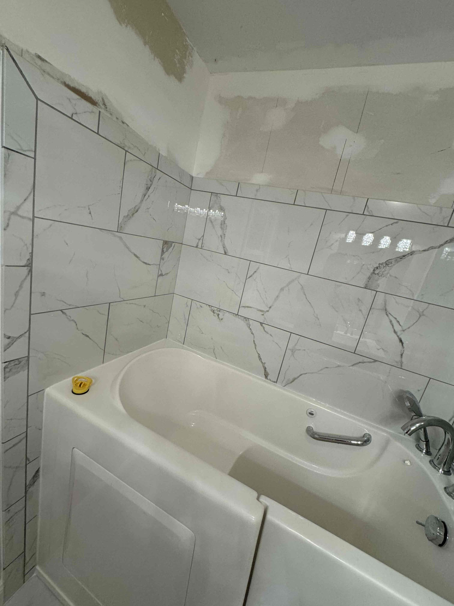 Luxury bathroom remodel in Spartanburg featuring custom tile work.