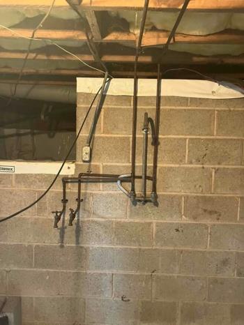 Tech tuning up an AC unit