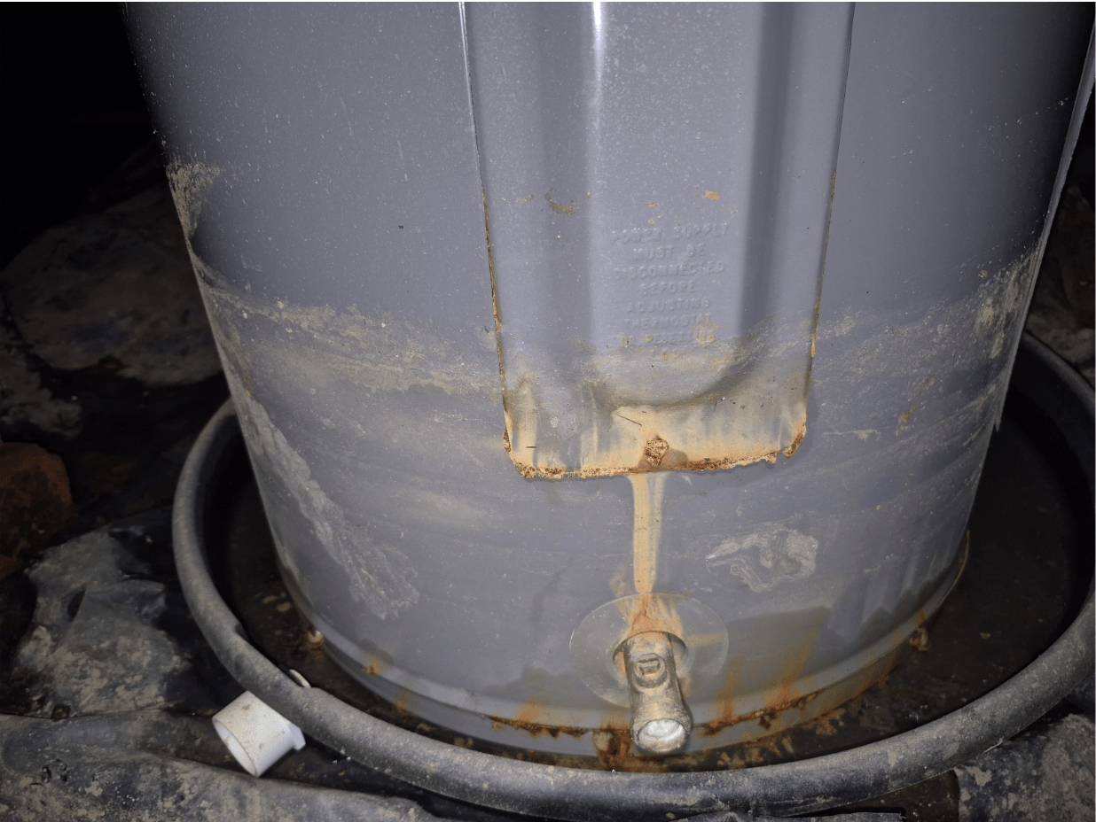 A Spartanburg water heater with mud rings around the bottom from flooding